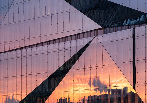 Sunset reflecting on a building's glass facade