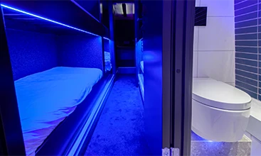 Geberit shower toilet in a modern, blue-lit bathroom that sets unconventional comfort standards