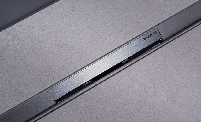 Elegant CleanLine50 shower channel made of brushed stainless steel, 3 cm wide with inclined drain