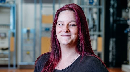 Sarah Berner, production foreman at Geberit in Pottenbrunn, smiles in the factory